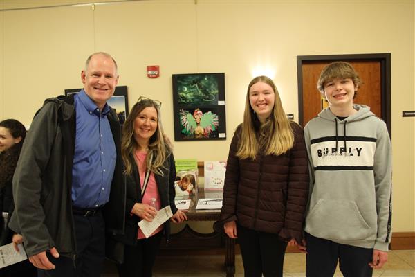 student and family with art 